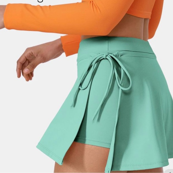 HALARA Dresses & Skirts - NWT‎ Halara Cloudful Air Lace Up 2-in-1 Side Pocket Mini Skirt Green Size M